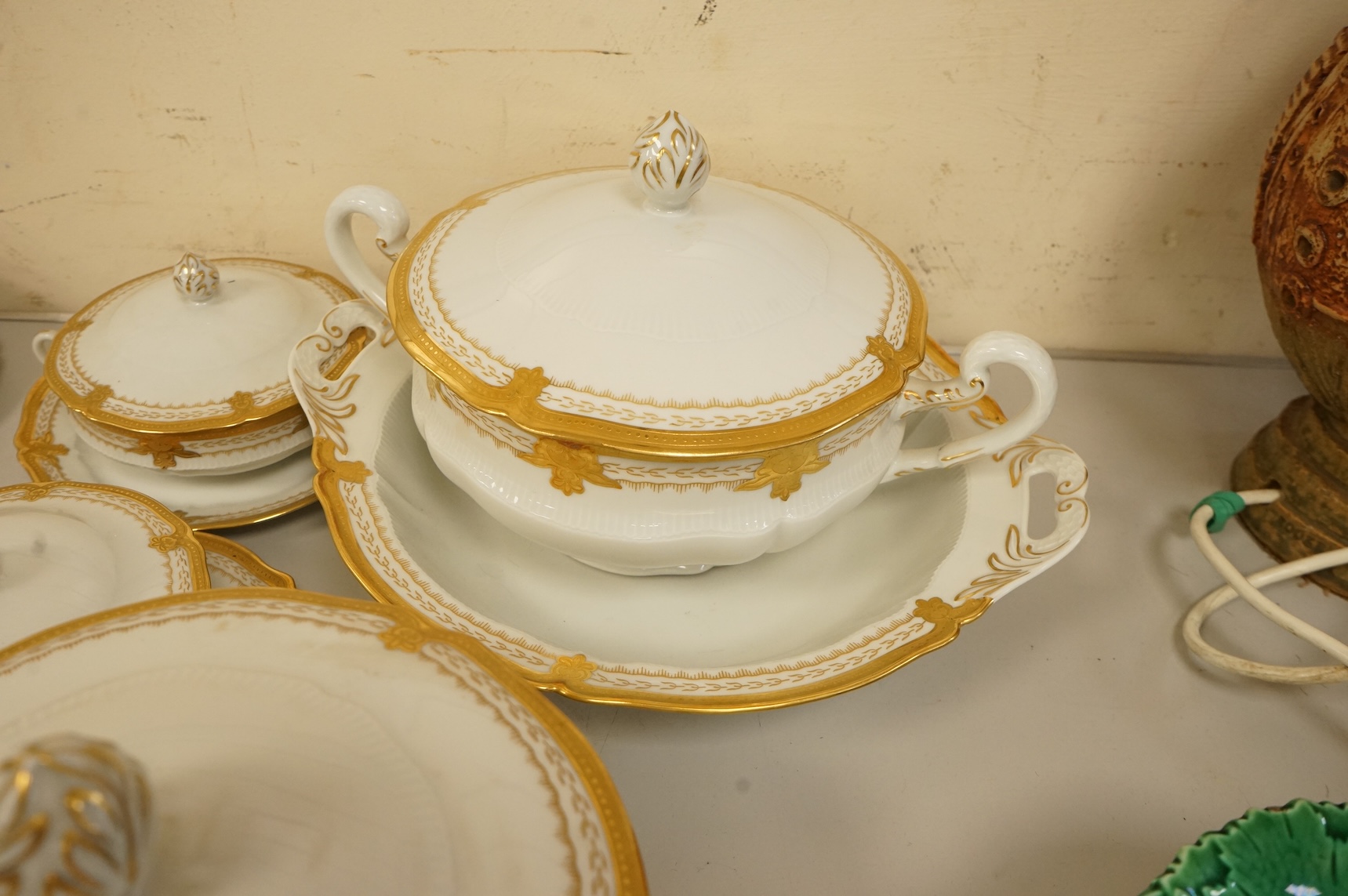 A Haviland Limoges dinner service with gilt border